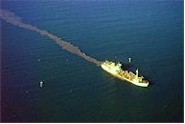 Aerial view of trawler and the trail of mud disturbance